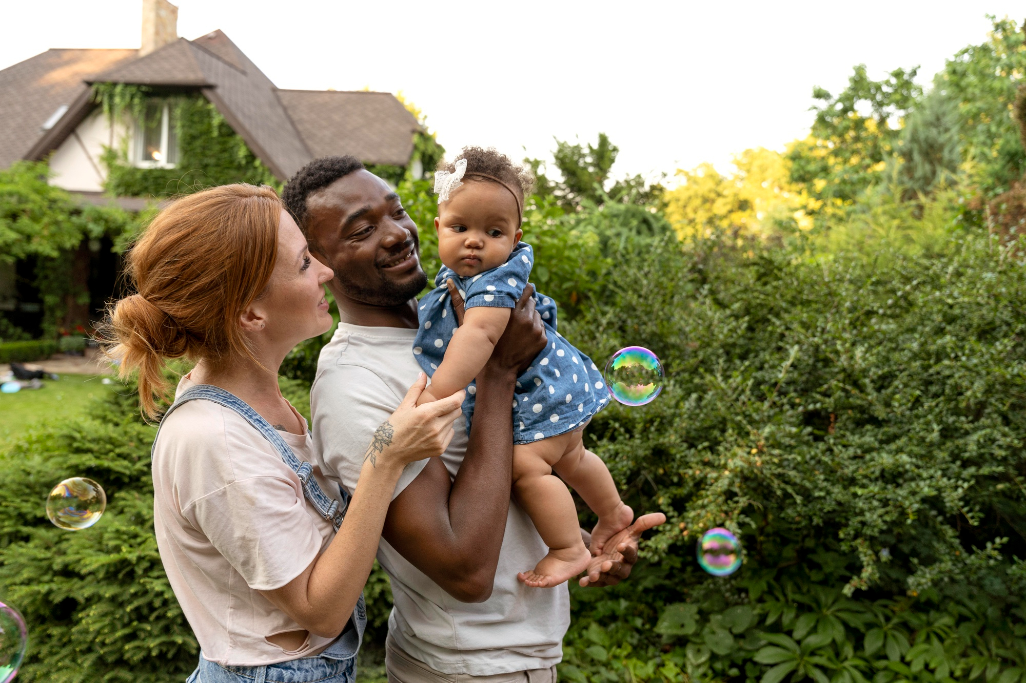 A happy young family enjoying their yard together